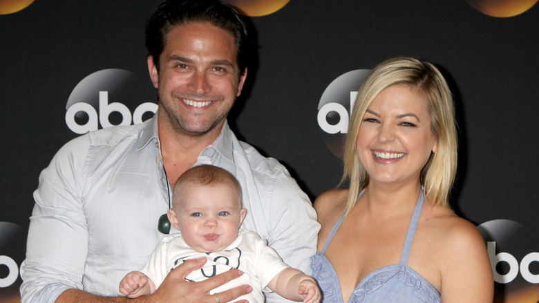 Brandon Barash and Kirsten Storms with their daughter at an event.
