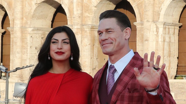 Shay Shariatzadeh with John Cena, waving