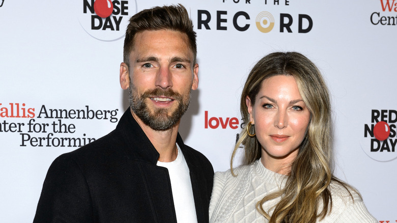 Andrew Walker and Cassandra Troy pose on the red carpet.