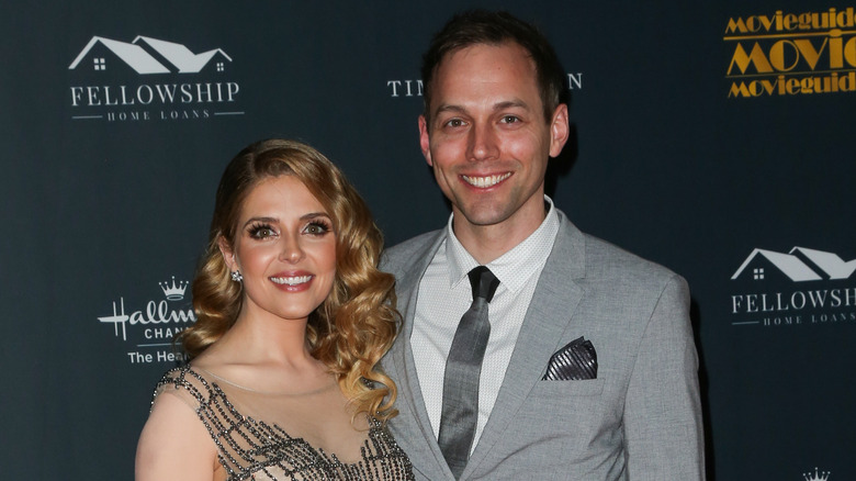 Jen Lilley and Jason Wayne on a red carpet.