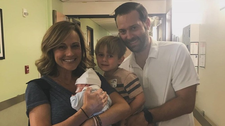 Nikki DeLoach and Ryan Goodell with their two kids at the hospital.