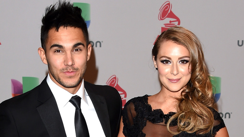 Carlos and Alexa PenaVega posing