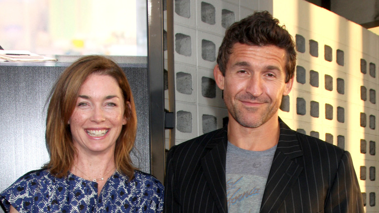 Julianne Nicholson and Jonathan Cake smile 