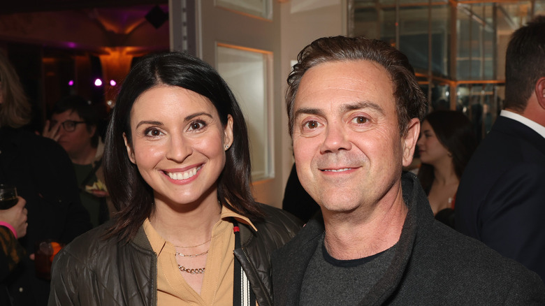 Beth Dover and Joe Lo Truglio smiling at camera