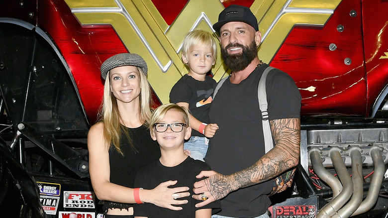 A.J. Cook posing with husband and children