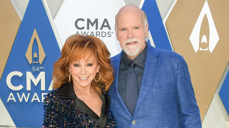 Reba McEntire and Rex Linn posing together