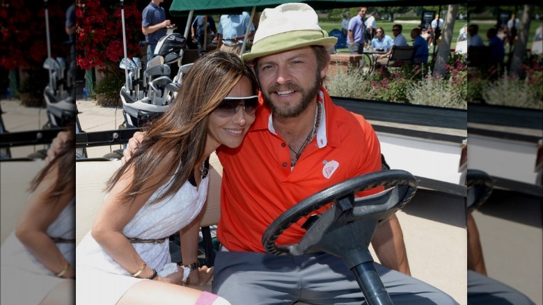 Vanessa Marcil and Carmine Giovinazzo, hugging in golf cart