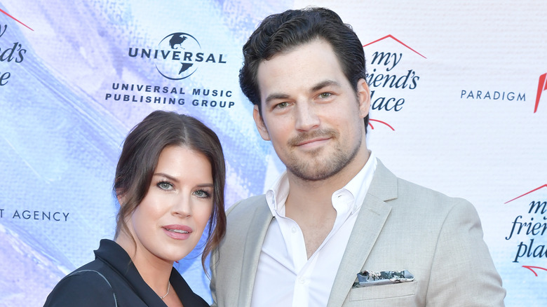 Nichole Gustafson and Giacomo Gianniotti smiling 