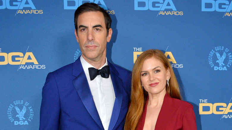 Sacha Baron Cohen and Isla Fisher posing 