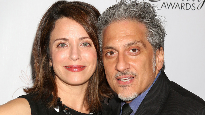 Alanna Ubach and husband Thom Russo smiling 