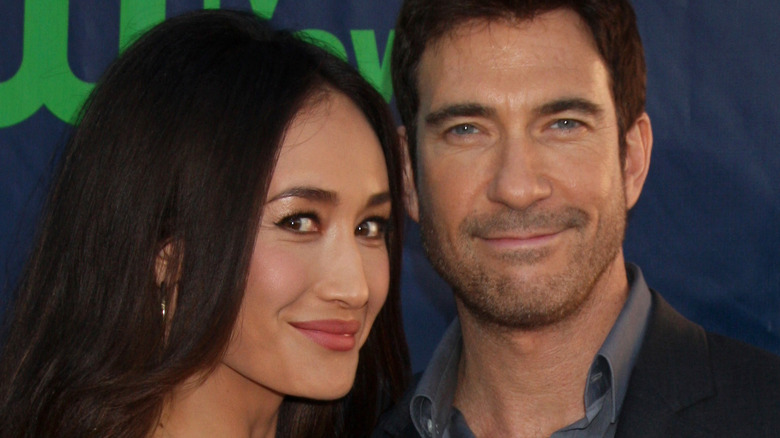 Dylan McDermott and Maggie Q, both smiling