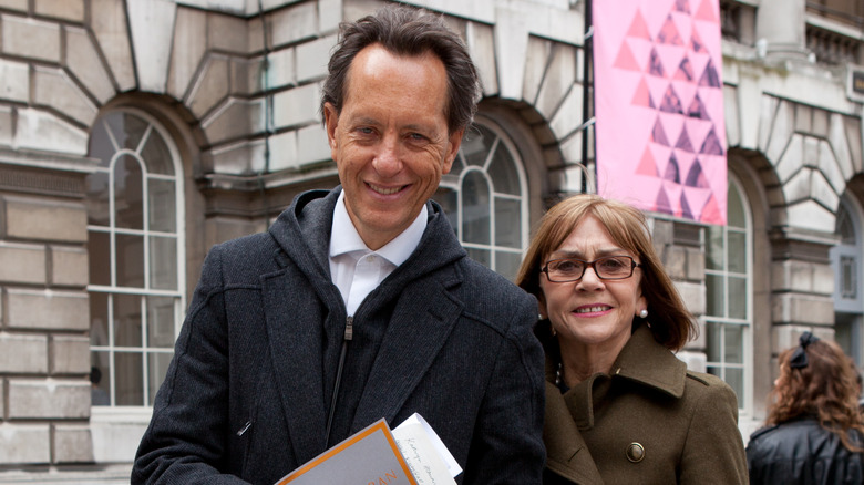 Richard E. Grant  and Joan Washington smiling 