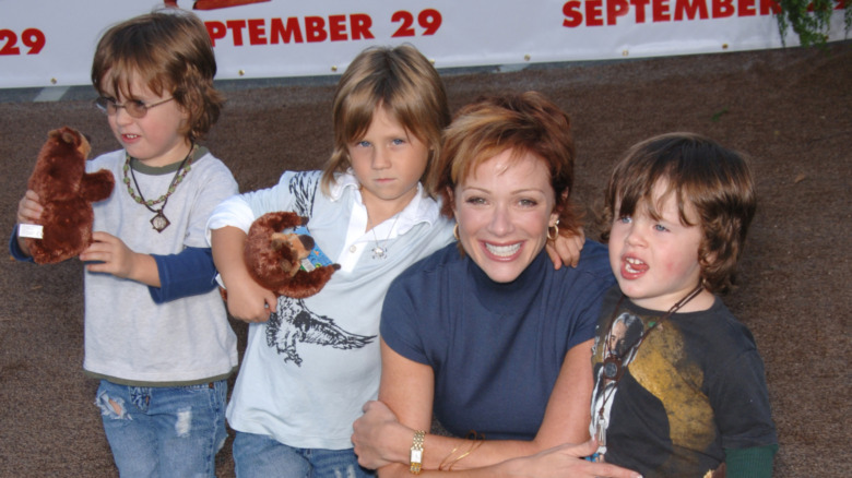 Lauren Holly smiles with her three sons 