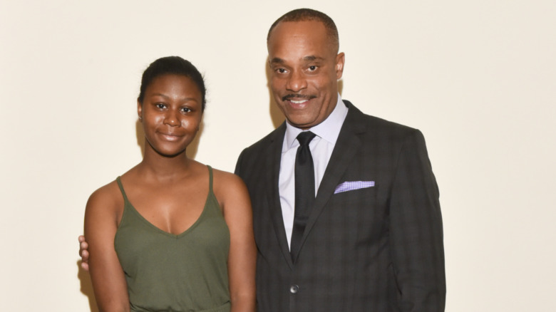 Rocky Carroll and his daughter Elissa smiling