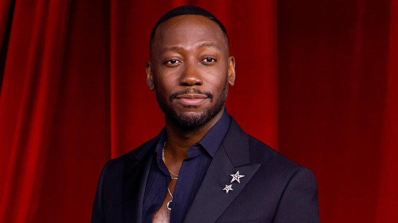 Lamorne Morris posing solo at the Academy Museum Gala.