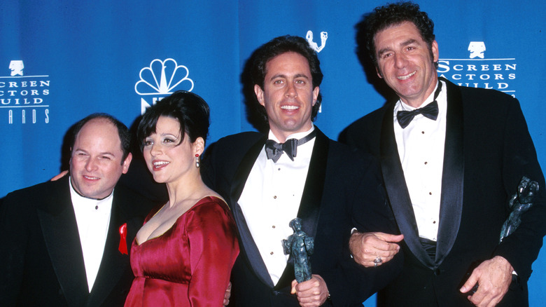 Seinfeld cast posing with awards