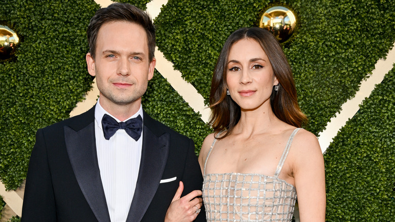 Patrick J. Adams, Troian Bellisario linking arms