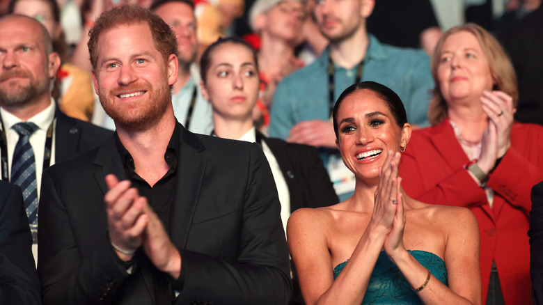 Prince Harry, Meghan Markle clapping