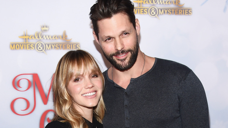 Alexa Havins and Justin Bruening at an event