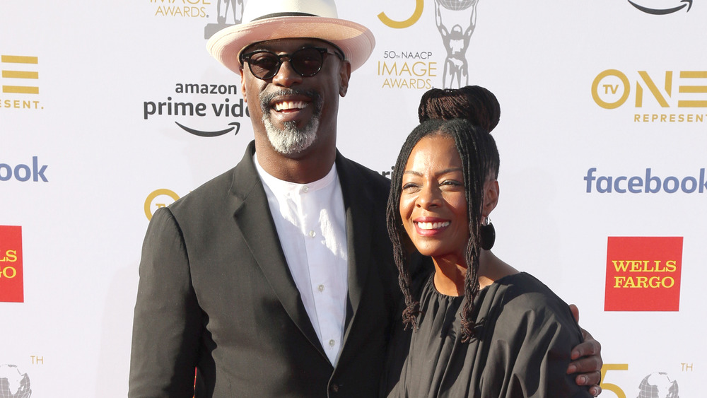 Isaiah Washington smiling with wife Jenisa Marie Garland