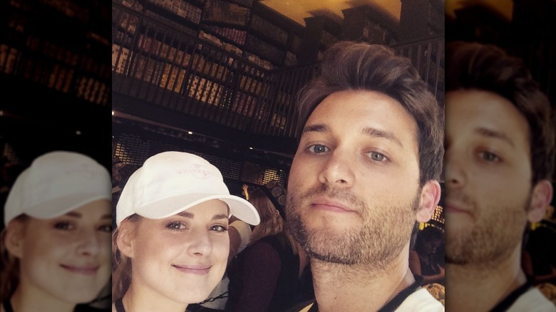 Alexandra Breckenridge smiling beside Casey Hooper