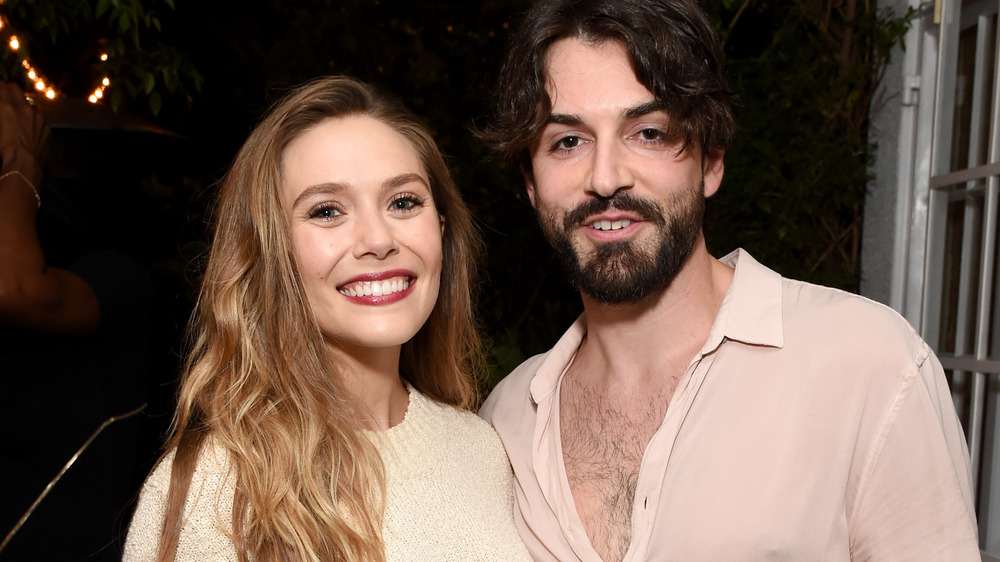 Elizabeth Olsen and Robbie Arnett smiling 