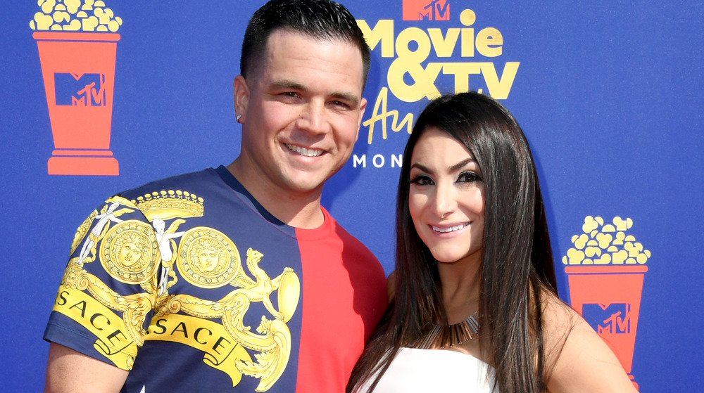 Chris Buckner and Deena Nicole Cortese on red carpet