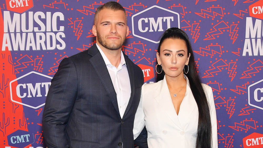 Zack Clayton Carpinello and Jenni Farley on red carpet