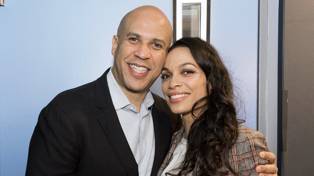 Cory Booker and Rosario Dawson, both smiling