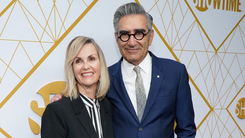 Deborah Divine and Eugene Levy smiling at an industry event 