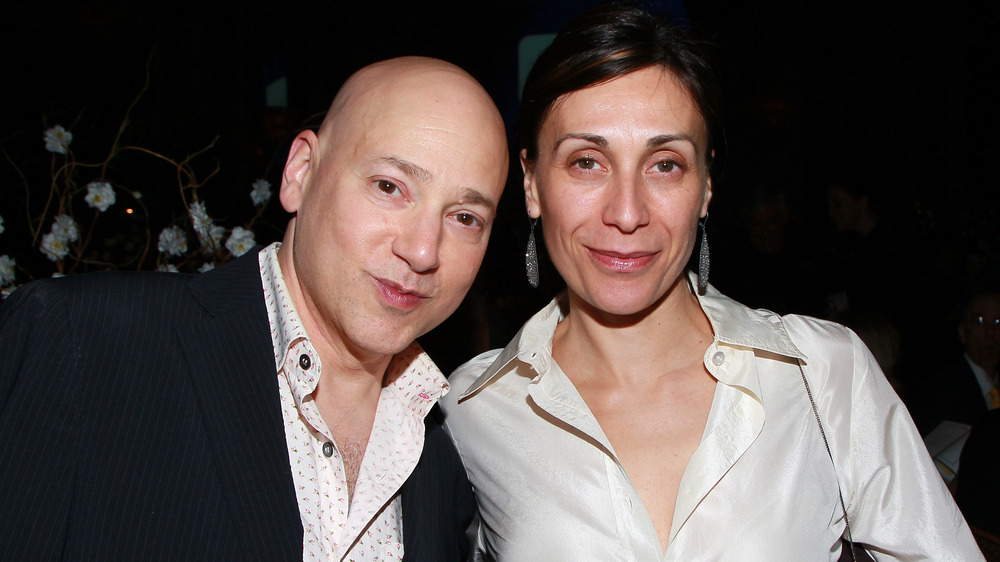 Evan Handler and Elisa Atti smirking 