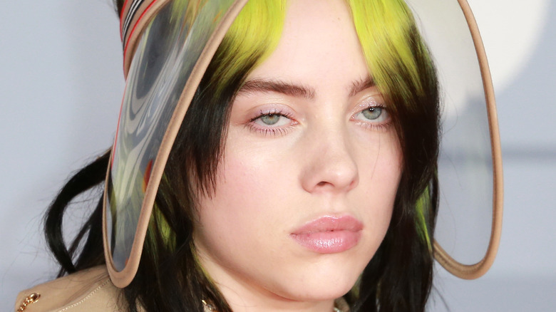 Billie Eilish poses for a photo with serious expression