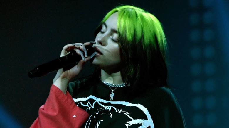 Billie Eilish, singing in 2020, looking sad 