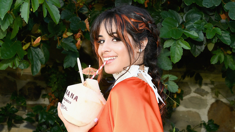 Camila Cabello sipping from a straw