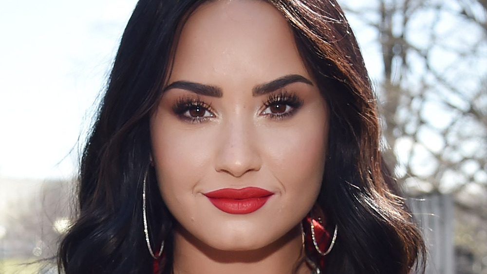 Demi Lovato sports red lipstick