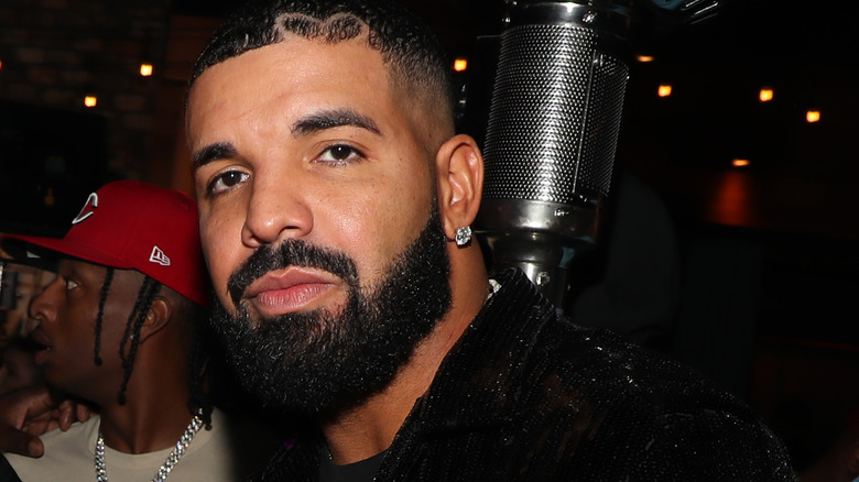 drake frowning with mic