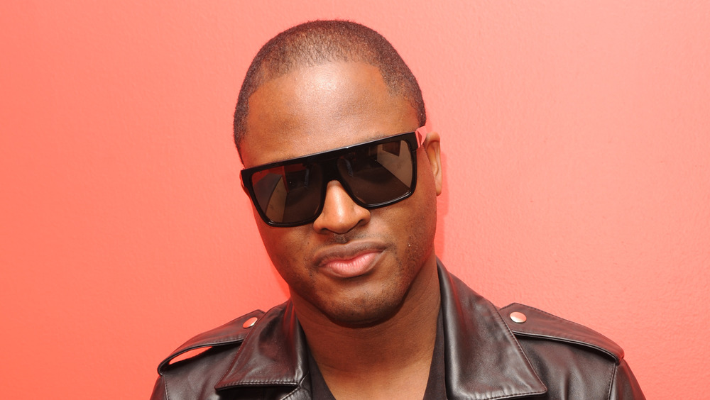 Taio Cruz wearing sunglasses and a leather jacket