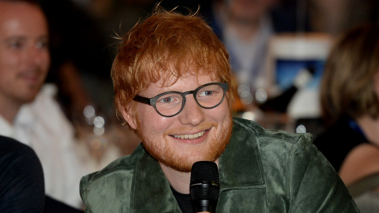 Ed Sheeran smiling at an event