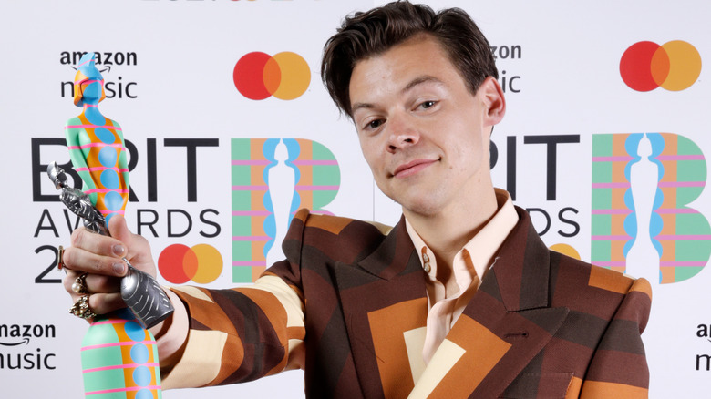 Harry Styles posing BRIT Awards 2021