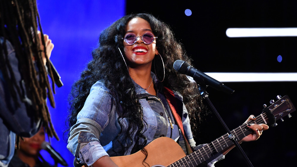 H.E.R. performing at the NAACP Image Awards in February 2020