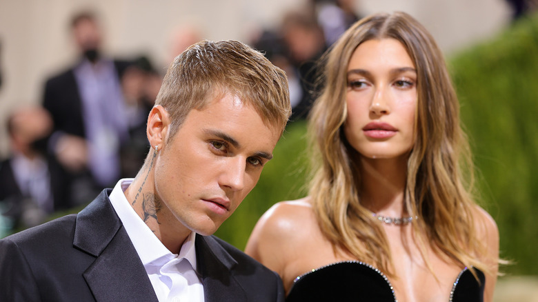 Justin Bieber and Hailey Bieber with serious expressions