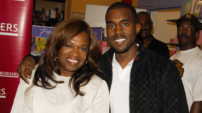 Kanye West with arm around mother Donda