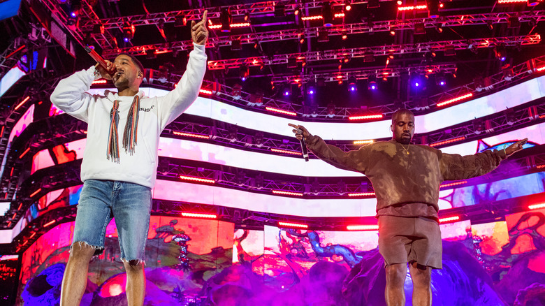 Kid Cudi performing with Kanye West