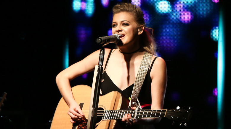 Kelsea Ballerini playing guitar