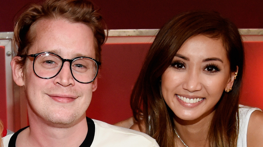 Macaulay Culkin and Brenda Song smiling