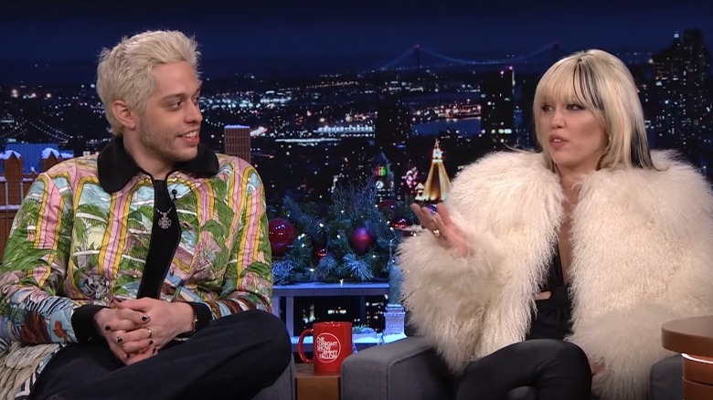 Pete Davidson looks at Miley Cyrus on The Tonight Show