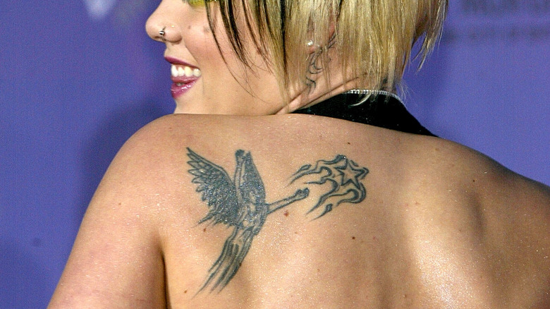 Pink with angel tattoo