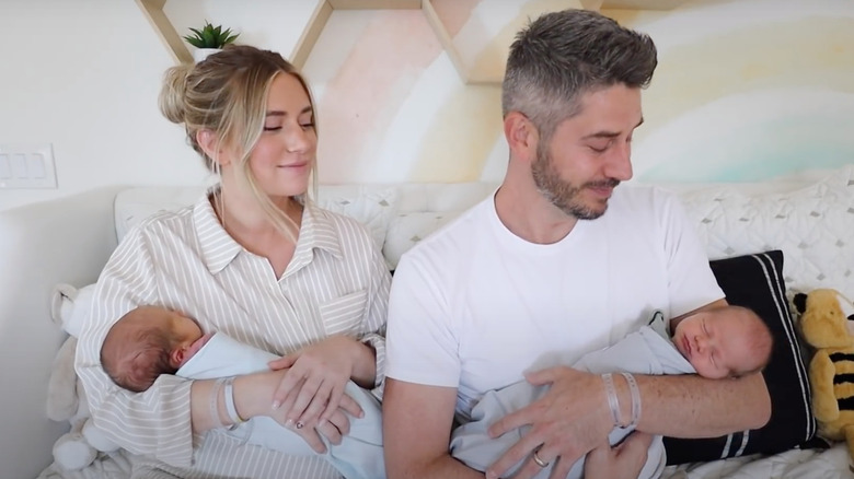 Lauren Burnham and Arie Luyendyk hold their newborn twins 