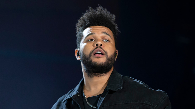 The Weeknd performing on stage at a concert