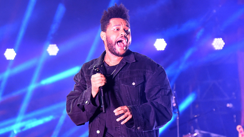 The Weeknd performing on-stage in 2018